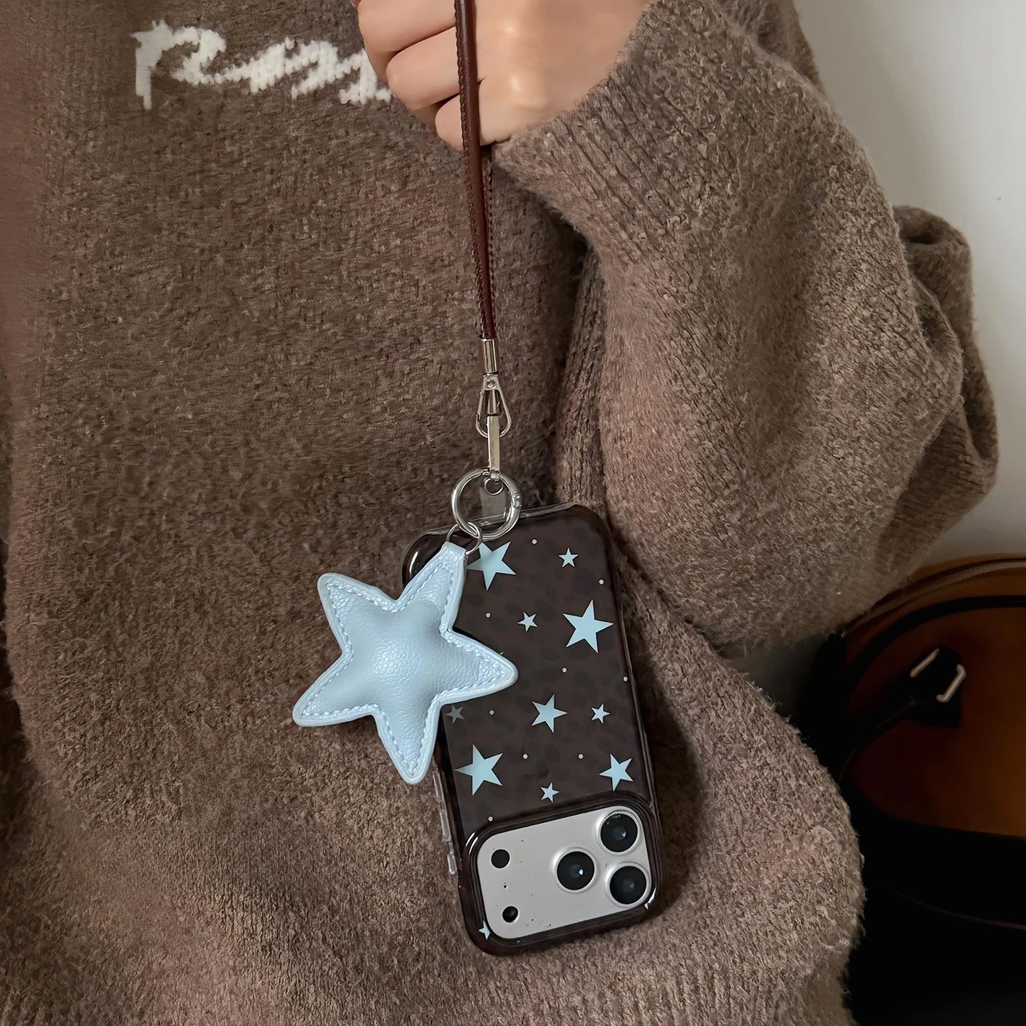 Dark Brown Leopard Print iPhone Case with Blue Star Accents, Reflective Tin Foil Texture